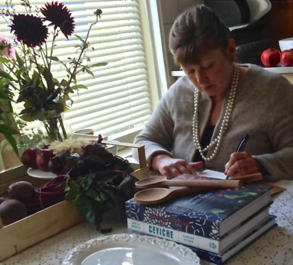 Terri writing in her kitchen